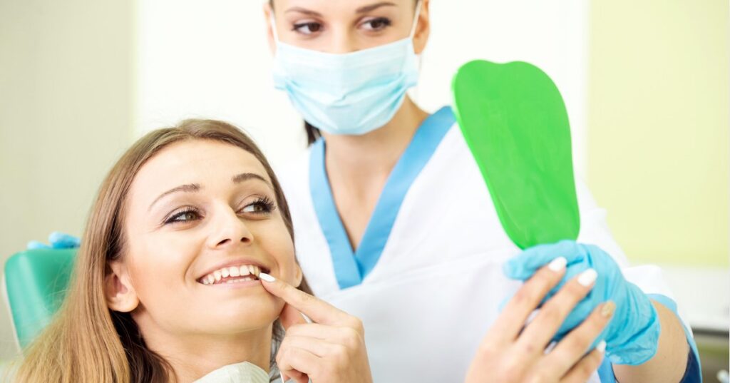 A women getting cosmetic crowns put in at the dentist office